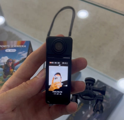 4K sports camera in hand with screen and box — iZone Lebanon